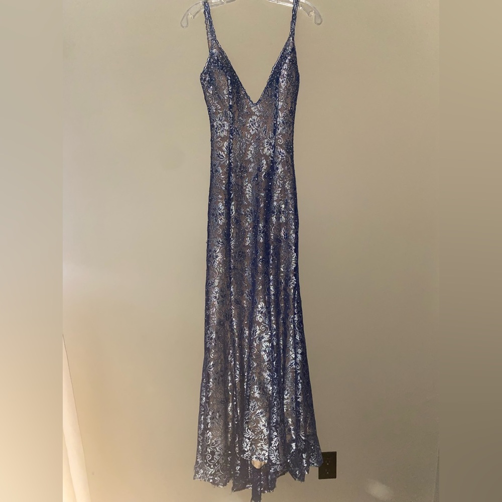 Selling a backless silver/bluish Jovani prom dress size 4